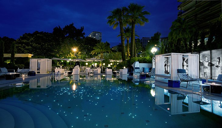 Glowing swimming pool at night at Hotel Metropole
