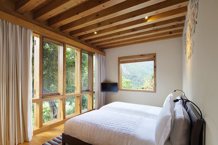 COMO Uma Punakha bedroom with nature views