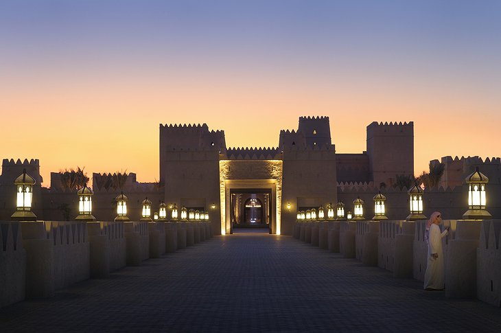 Qasr Al Sarab Desert Resort gate entrance at night