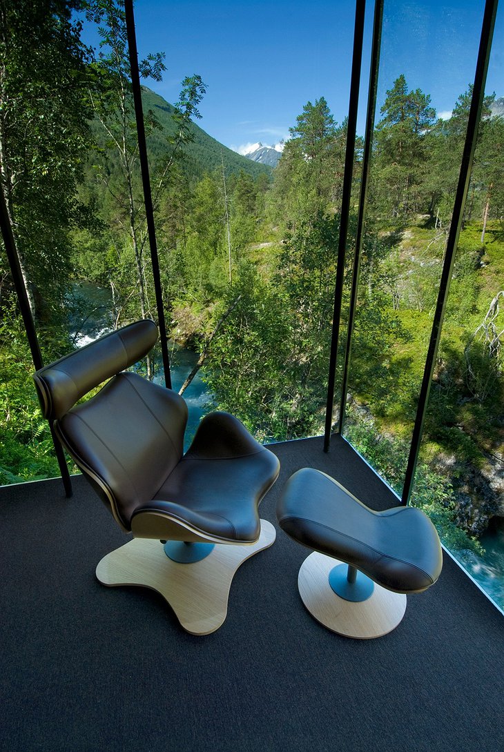 Juvet Landscape Hotel room with splendid nature view through the large glass window