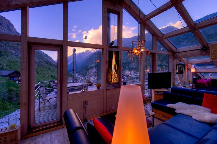 Heinz Julen Penthouse living room at night with Zermatt views