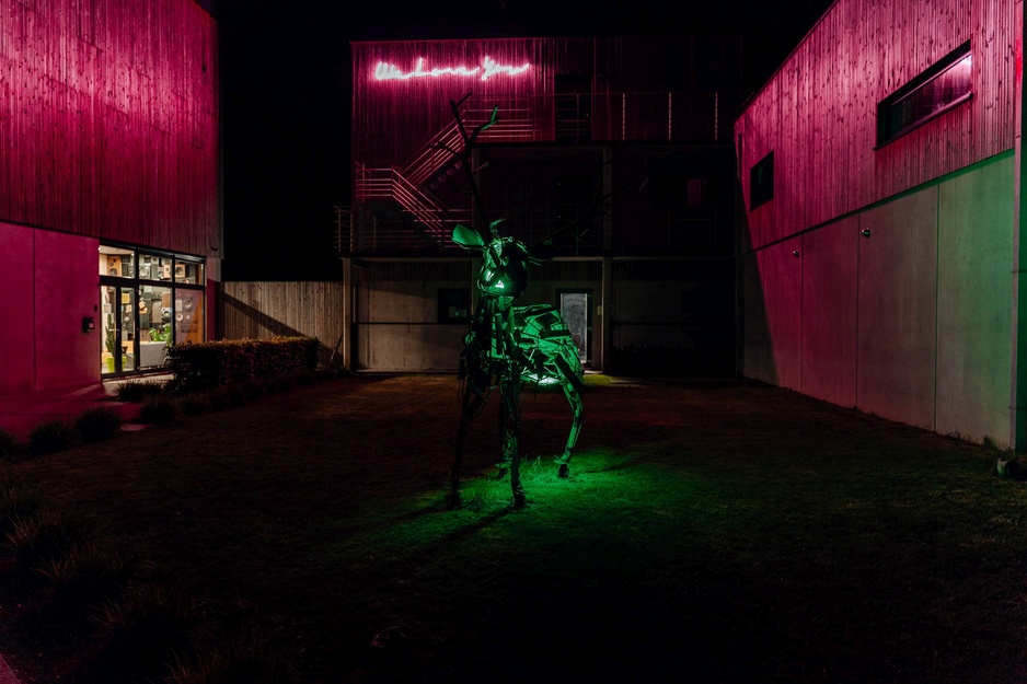 Daft Hotel Sculpture by Kenny Leys at Night