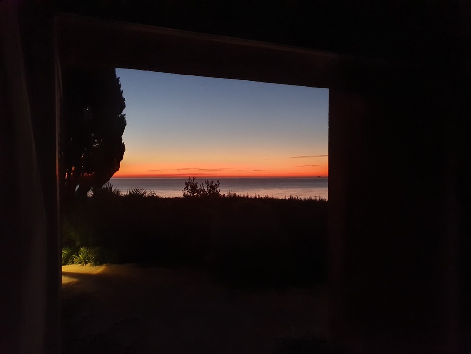 La Muralla Roja Loft Sunrise Through the Window