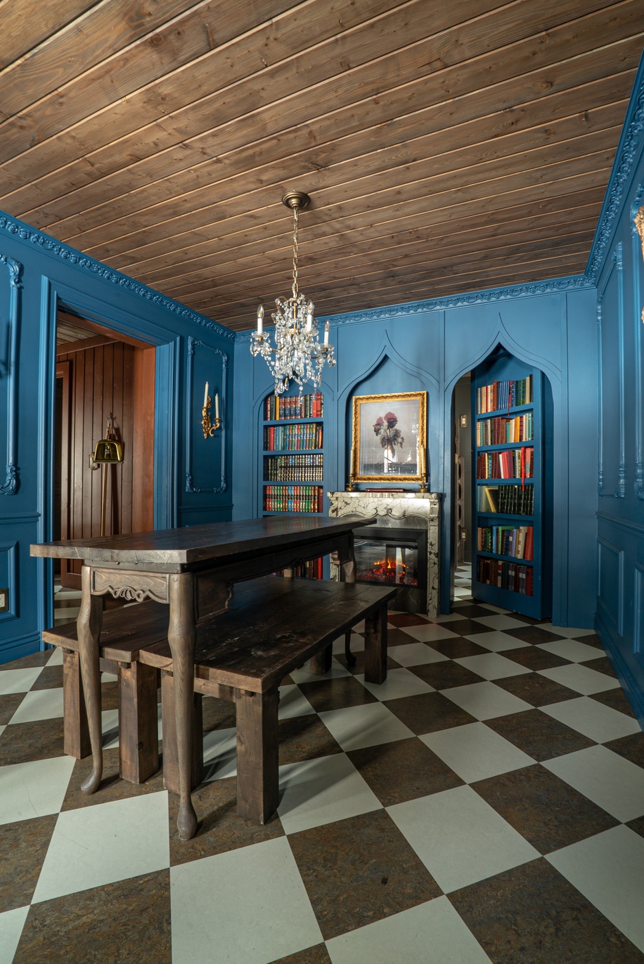 Charmed Resorts Crowsnest Pass - Beast's Castle's library with a secret door