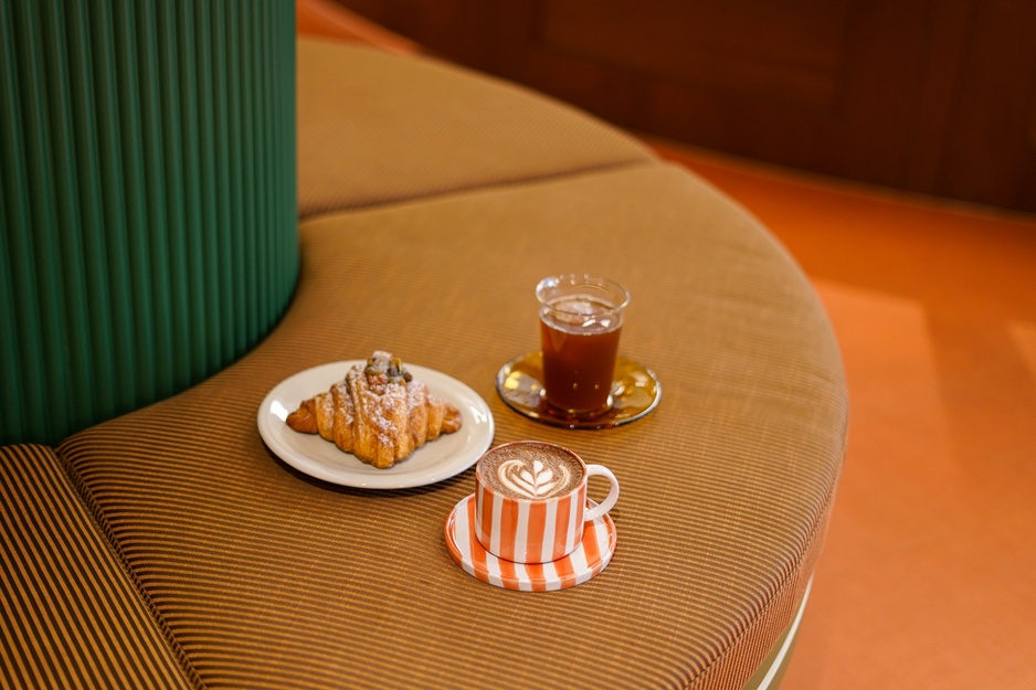 The Tres Hotel Café Breakfast Consisting of a Hot and Iced Coffee and a Sweet Pastry