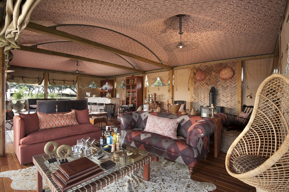 Somalisa Camp Main Lounge and Bar Area with a Fireplace