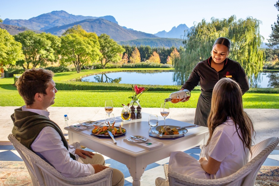 La Residence Dining Terrace Couple Enjoying the Food and Wine