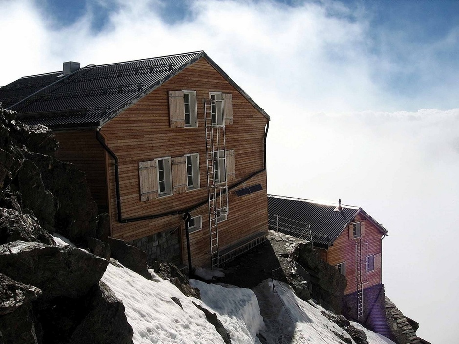 Mischabel Hut above the clouds in the Alps