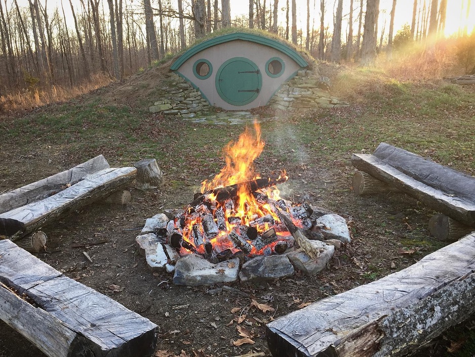 Forest Gully Farms Hobbit Hut with a Firepit Outside