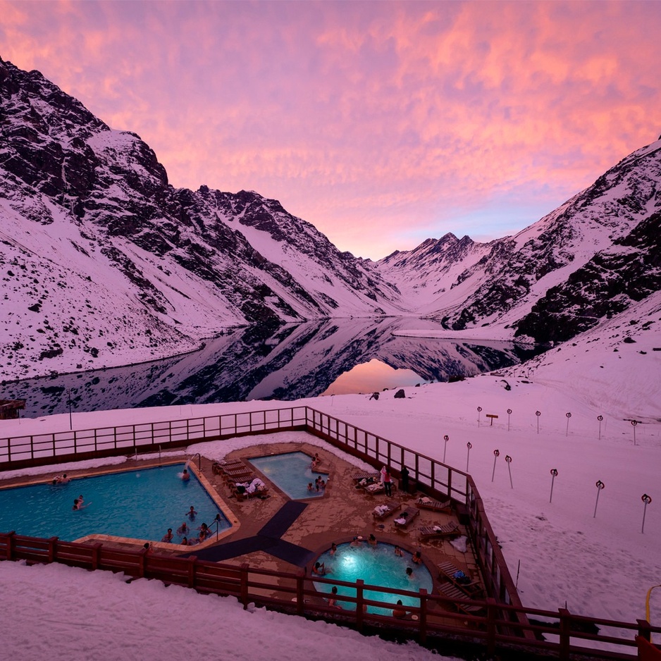 Hotel Portillo Outdoor Heated Pools During Sunset with view of the Lake and the Mountains