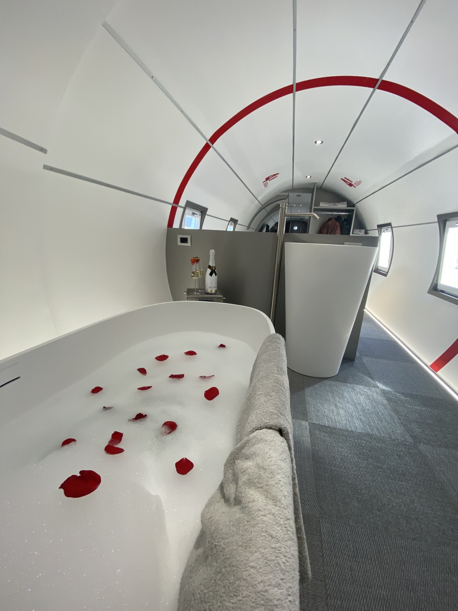 Natur Air Suite Glamping Airplane Hull Interior with a Bathtub