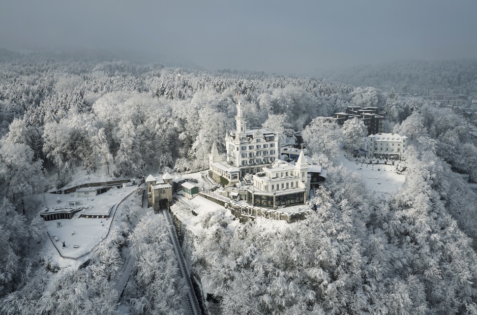 Hotel Château Gütsch Aerial During Winter With Snowy Landscape