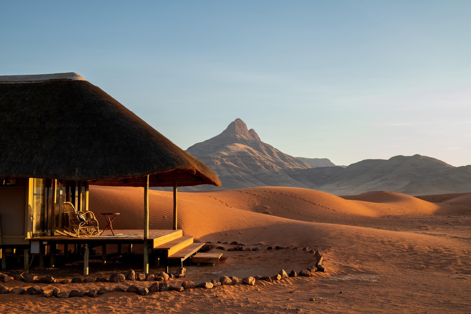 Kwessi Dunes Chalet Exterior with Orange Sand and Dunes
