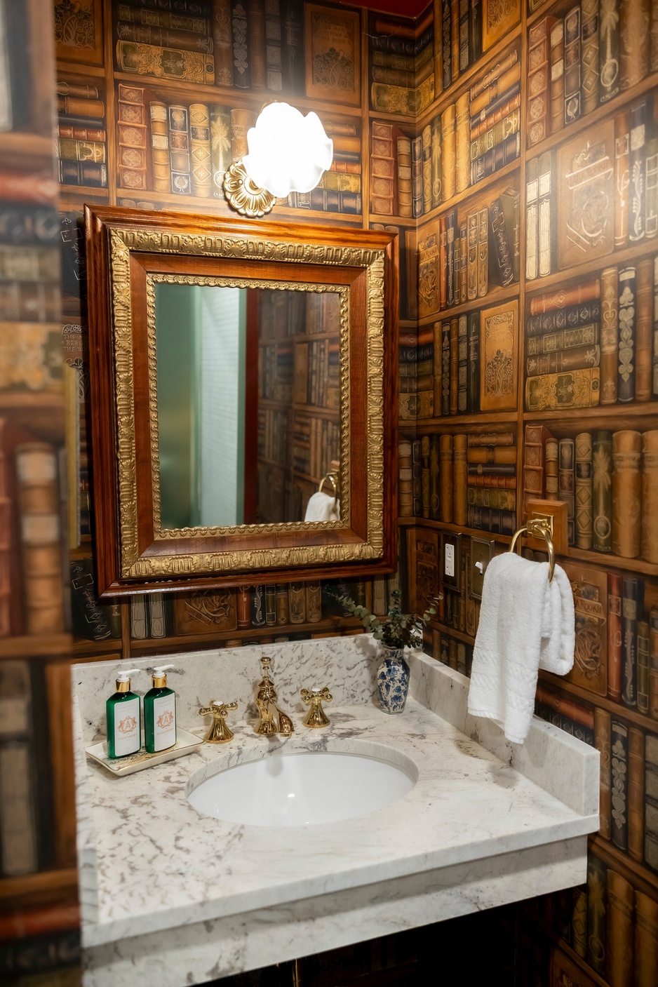 The Aldenberg Hotel Library Suite's Bathroom with Book Wallpaper