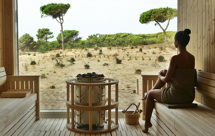 The Oitavos Hotel Sauna with panoramic floor-to-ceiling windows on the wilderness of the Sintra-Cascais Natural Park