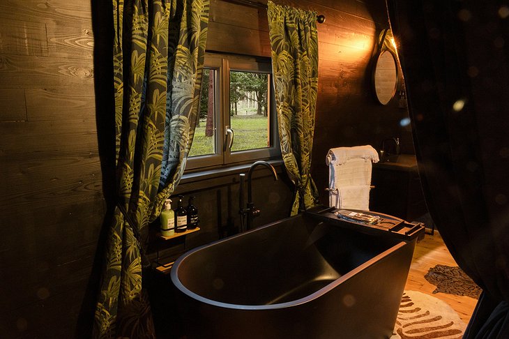 Lost in Sensations Hotel Out of Africa Lodge Bathroom With Freestanding Bathtub