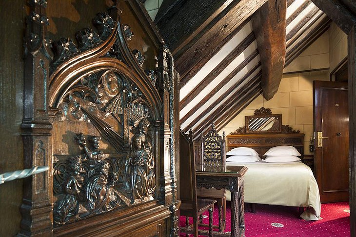 Hotel Saint Merry bedroom with vintage wooden Gothic furniture