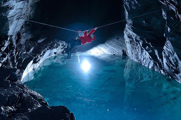 Rope climbing above the underground lake