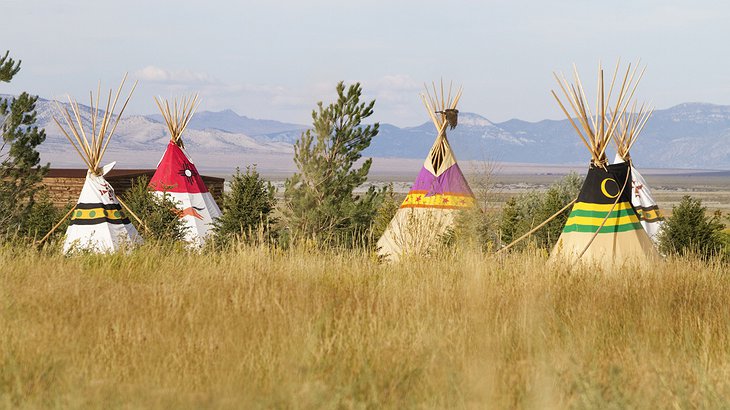 Mustang Monument Resort tipis and mountains