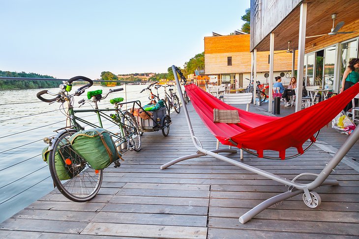 ArkaBarka Floating Hostel terrace with hammock and bikes