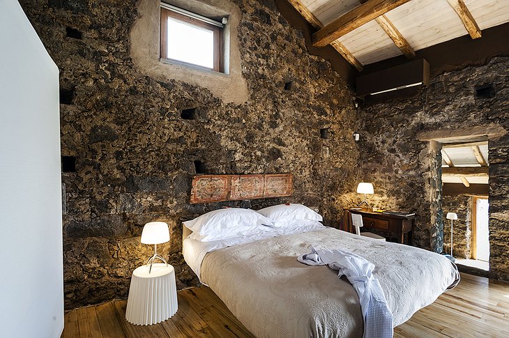 Monaci delle Terre Nere stone wall bedroom