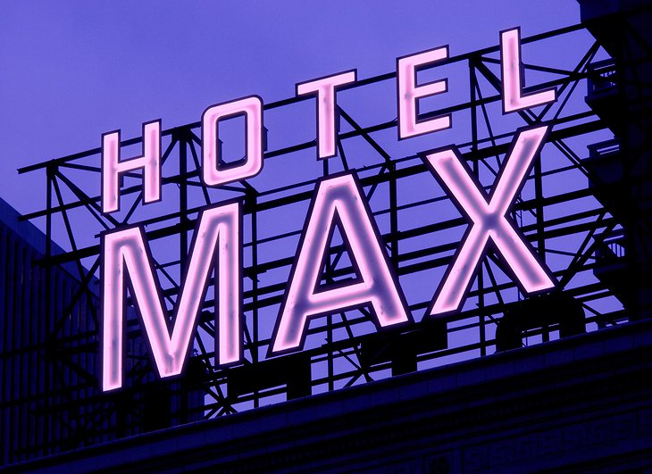 Hotel Max neon-lit sign on top of the building