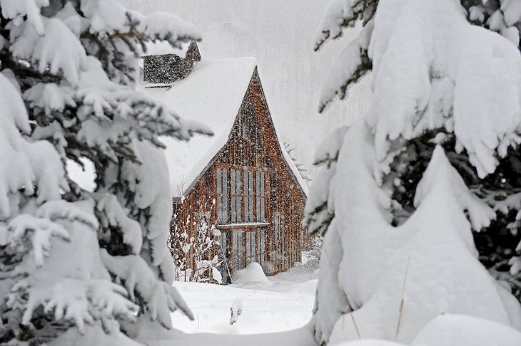 Wood cabin under the snow