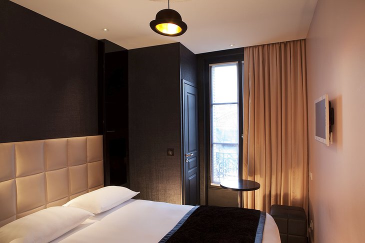 First Hotel Paris bedroom with cylinder hat lamp