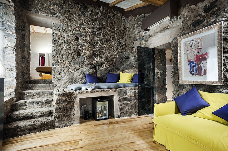 Monaci delle Terre Nere room with stone walls