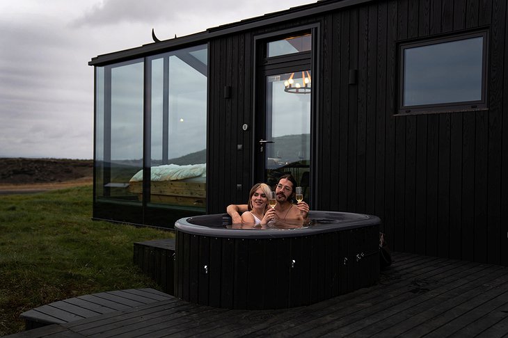 Couple In The Hot Tub Of Panorama Glass Lodge