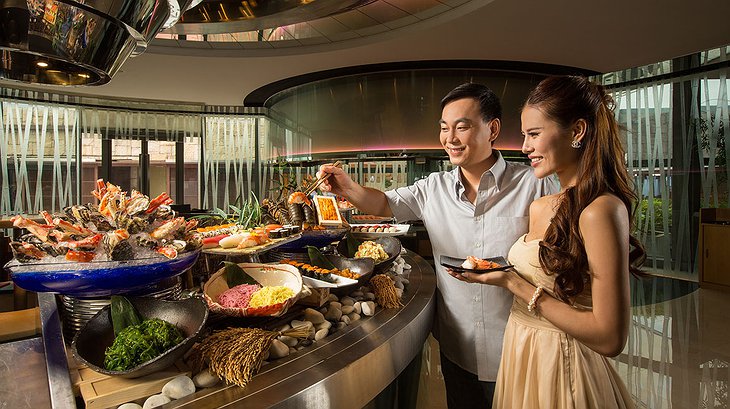 Asian couple taking food at Altira Macau hotel