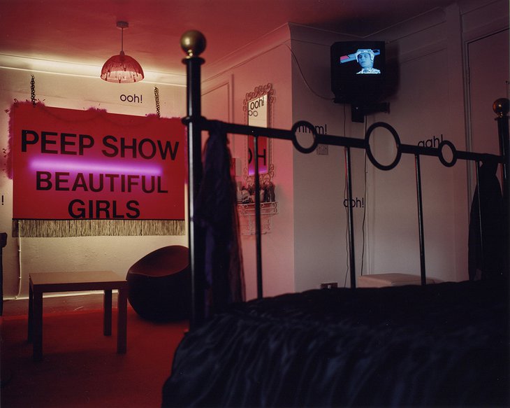 Peep show beautiful girls sign in the room of Hotel Pelirocco
