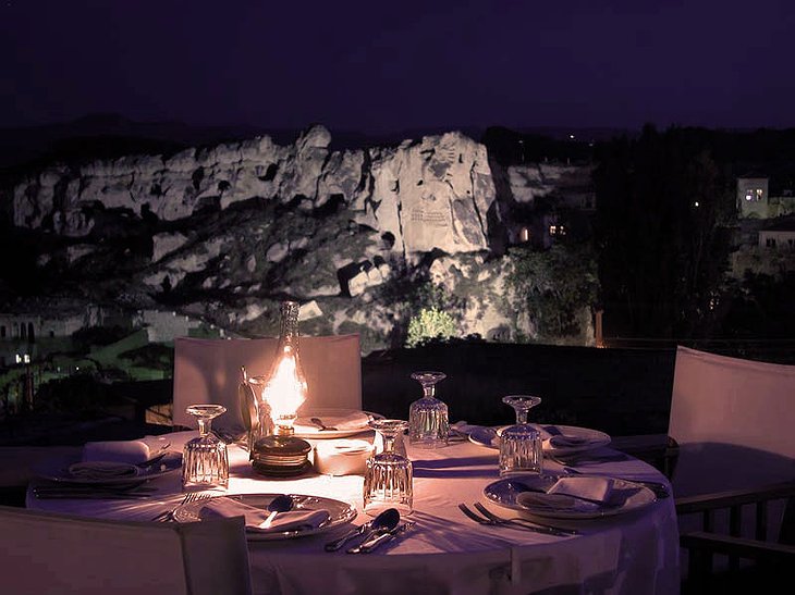 Yunak Evleri rooftop dining at night
