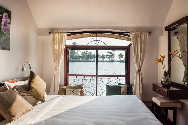 Xandari Riverscapes Houseboat Hotel Bedroom With Large Window Overlooking Kerala's Wild Nature