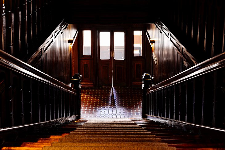 The Henry Jones Art Hotel Dark Wooden Staircase