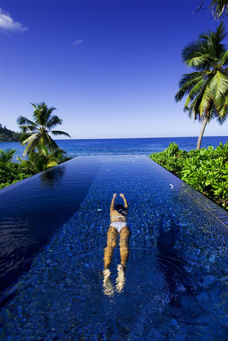 Girl swimming in the infinity pool