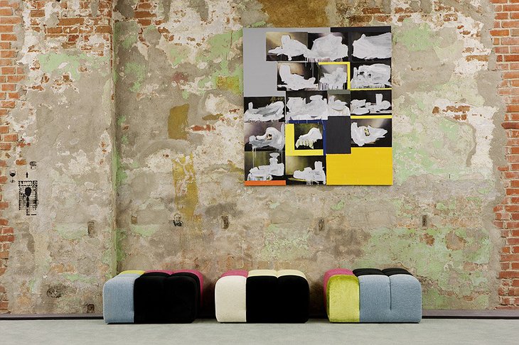 Andels Hotel Lodz brick wall and colorful ottomans