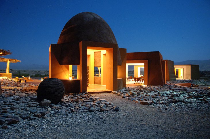 Okahirongo Elephant Lodge entrance buildings at night