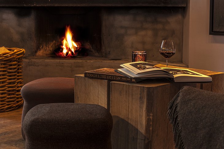 Fireplace lit lounge at Hotel Brosundet