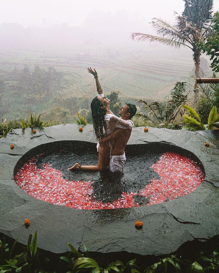 Romantic Couple In The Granite Rock Pool Of Magic Hills Bali
