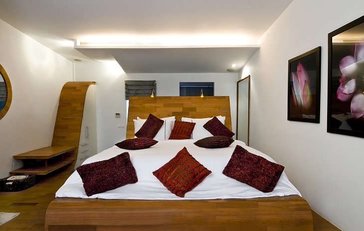 The One Hotel Angkor luxury wooden bed