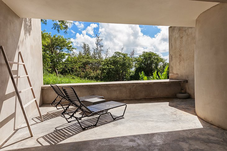 Triangular house concrete balcony with jungle view