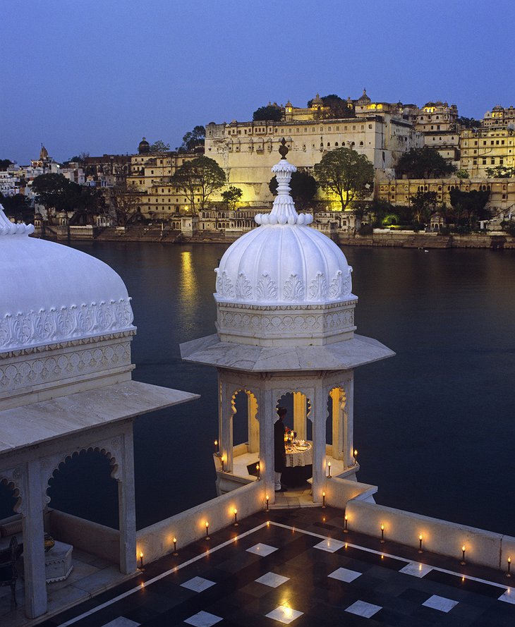 Lake Palace Hotel rooftop terrace at night with candles