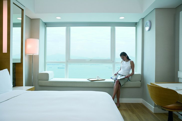 Traders Hotel room with a girl reading a magazine