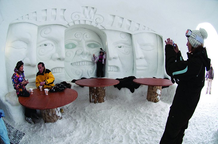 Small girl posing with an ice sculpture