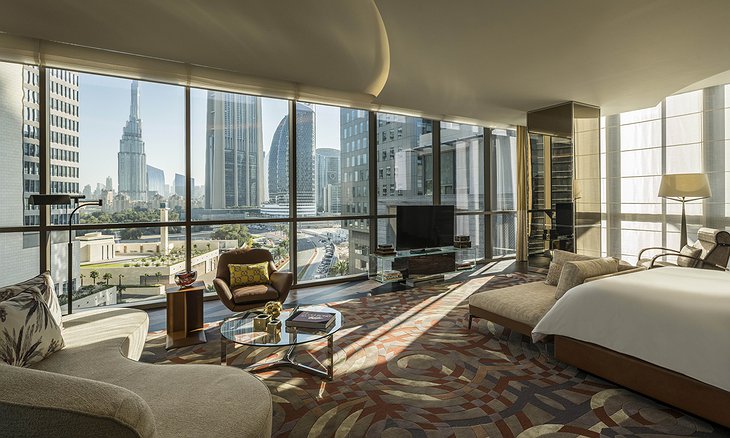 Four Seasons Dubai DIFC room with floor to ceiling glass windows and Burj Khalifa panorama