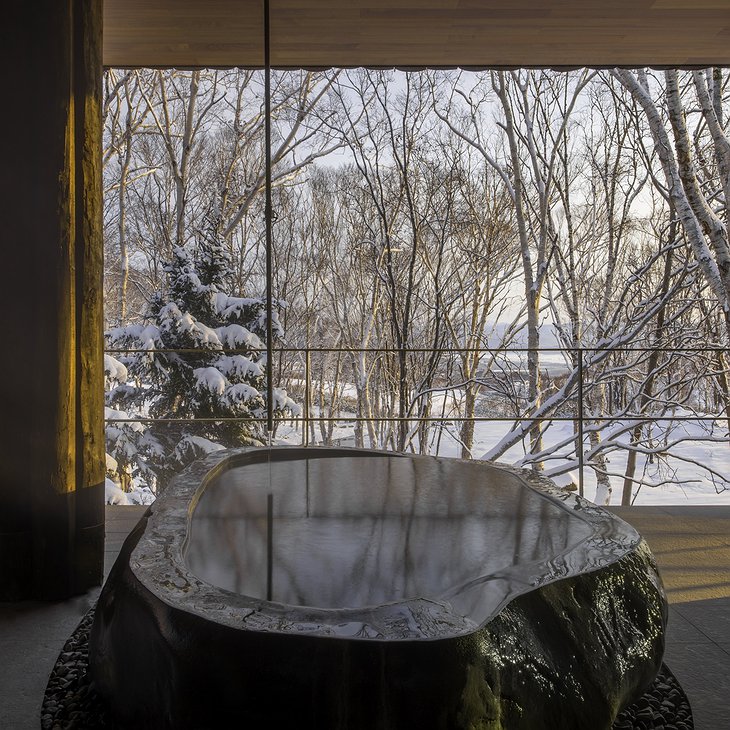 Zaborin Ryokan outdoor hot tub with nature view