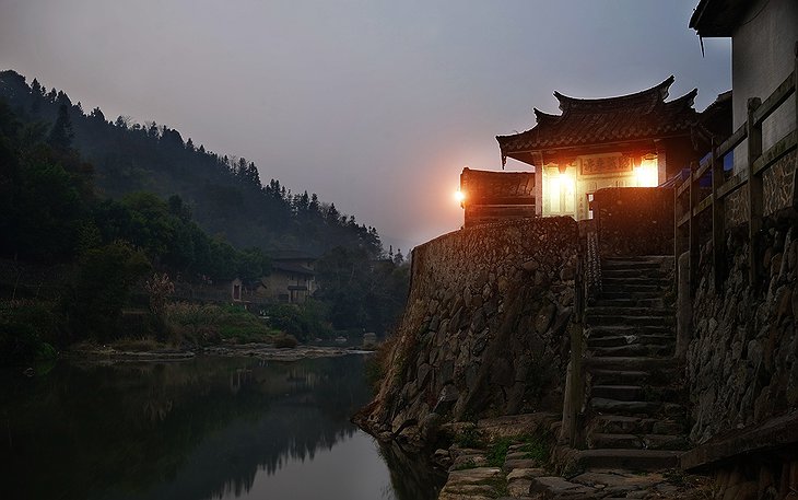 Tulou Fuyulou Changdi Inn at the River at Night