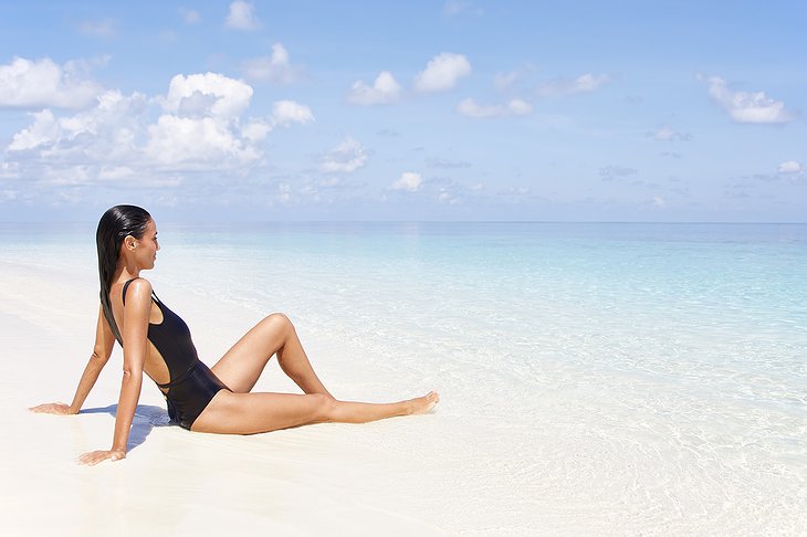 Woman At The Maldives Beach