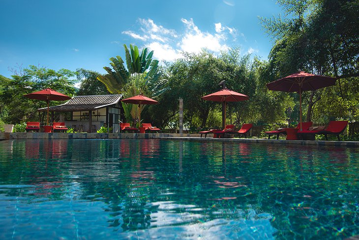 Muang La Lodge Infinity Pool With Red Sun Decks
